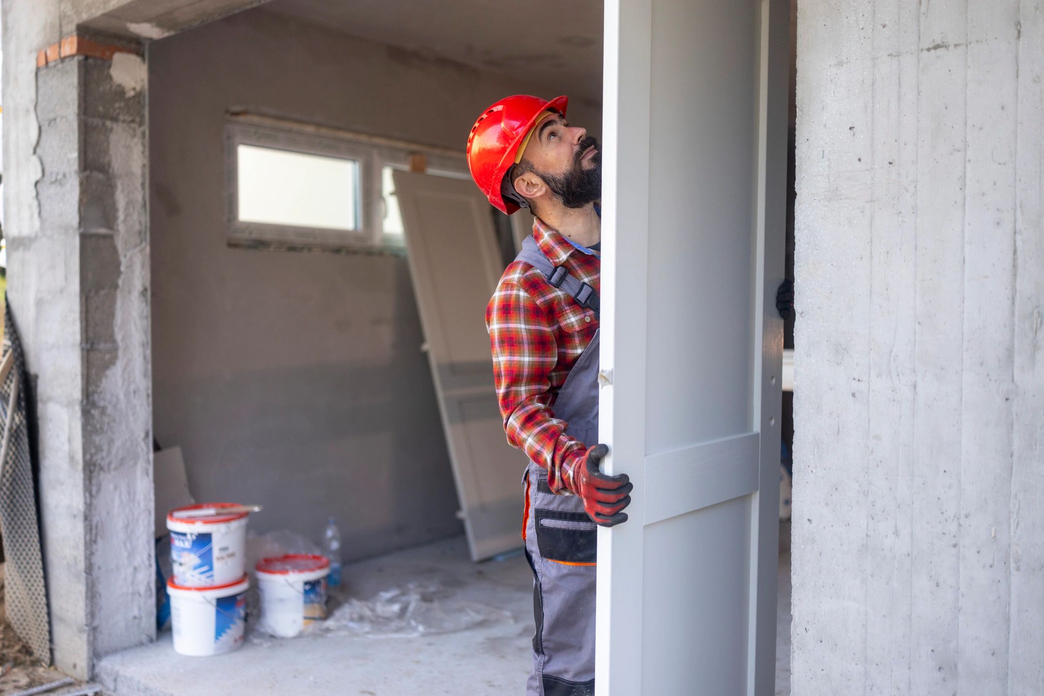 Worker installing an interior door